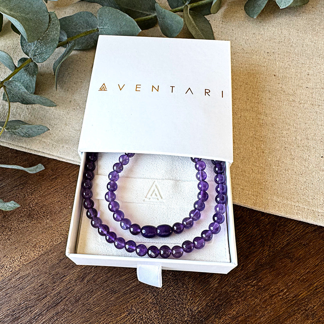 Deep purple Aventari Amethyst Wisdom Necklace displayed in its white branded gift box for clarity and spiritual power.