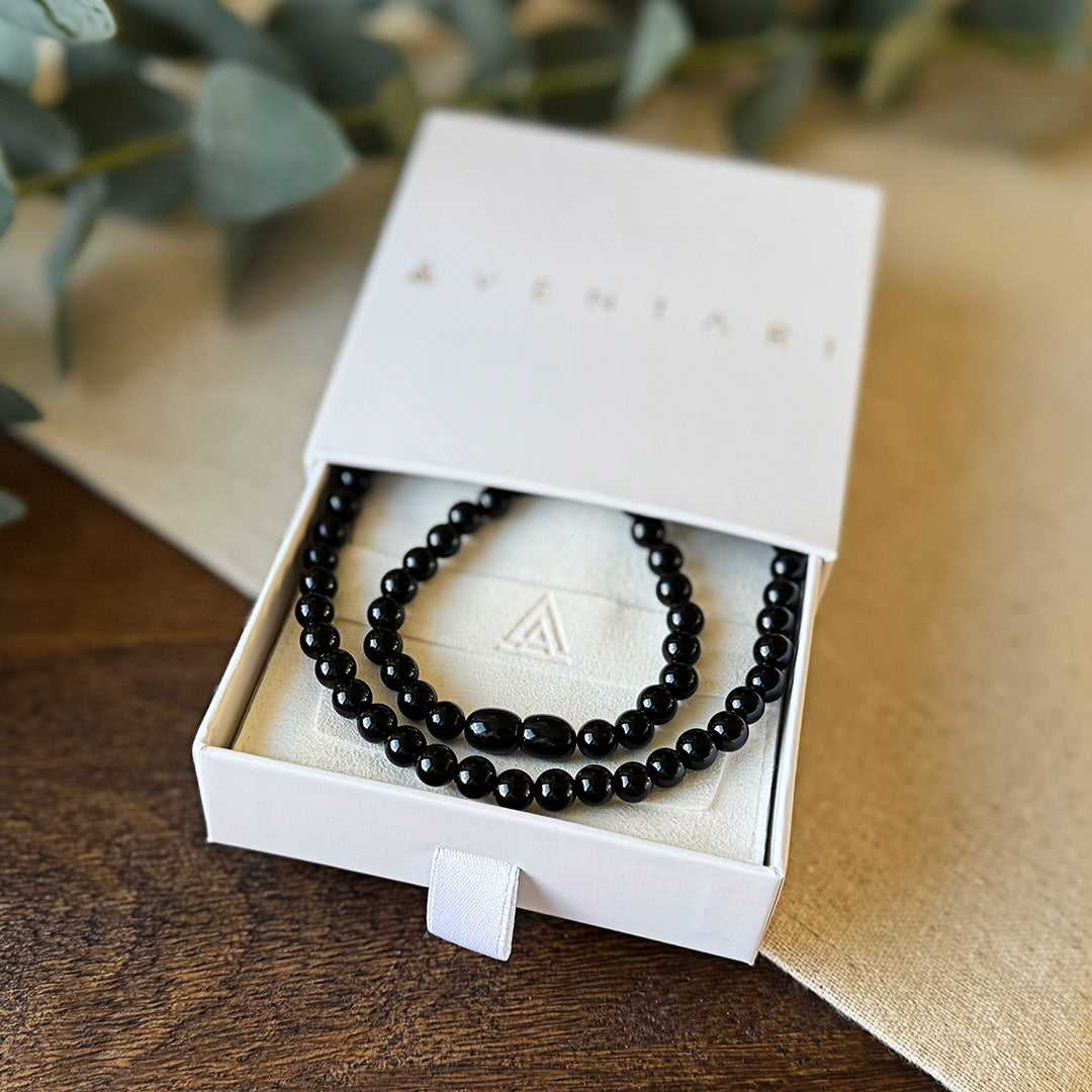 Polished Black Onyx Purpose Necklace by Aventari presented in its white branded gift box for focus and strength.