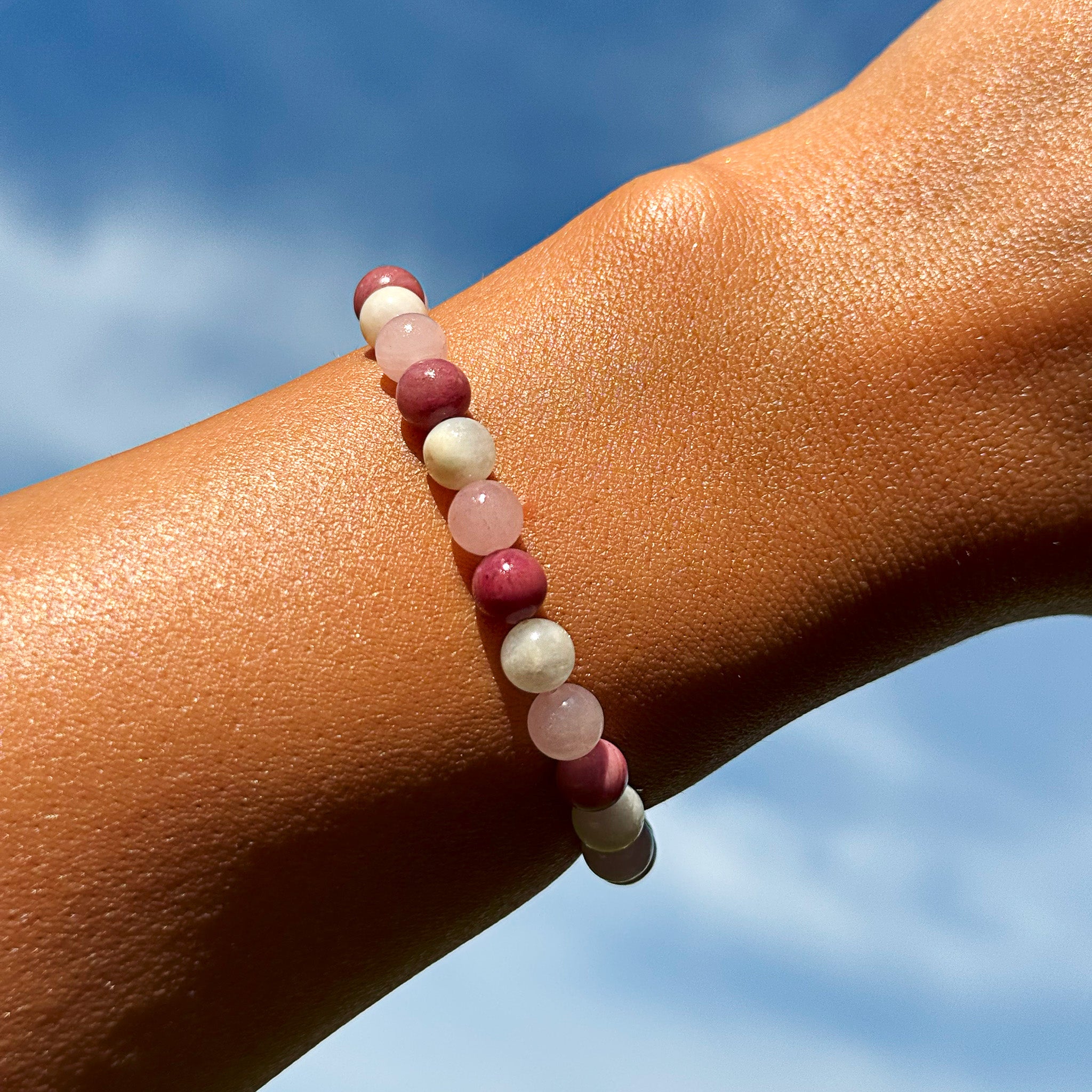 Aventari Pure Gemstone Love Bracelet with Rose Quartz Moonstone and Rhodonite photo on hand